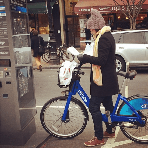 She's reading a map, not The Daily News.